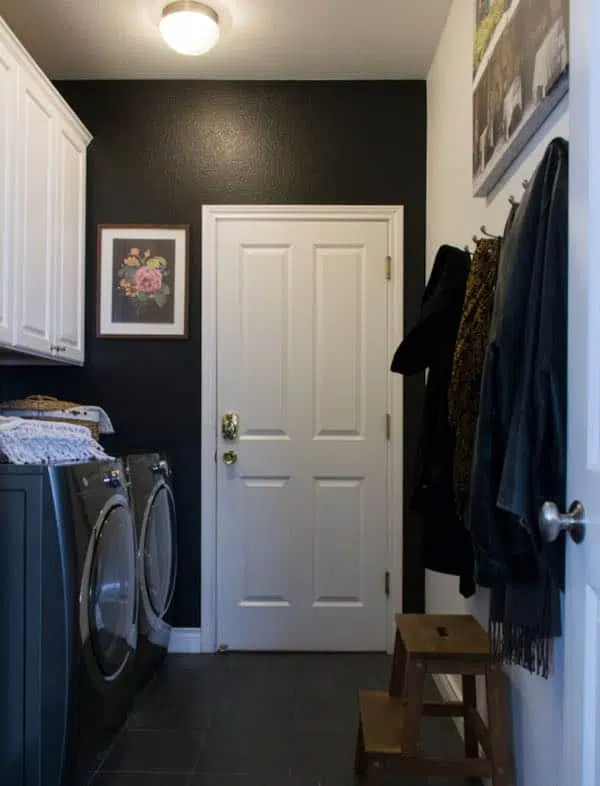 Laundry room with black walls, white cabinets and gray washer and dryer. Chantilly Lace OC-65, Laundry Room, Onyx 2133-10, White Cabinets