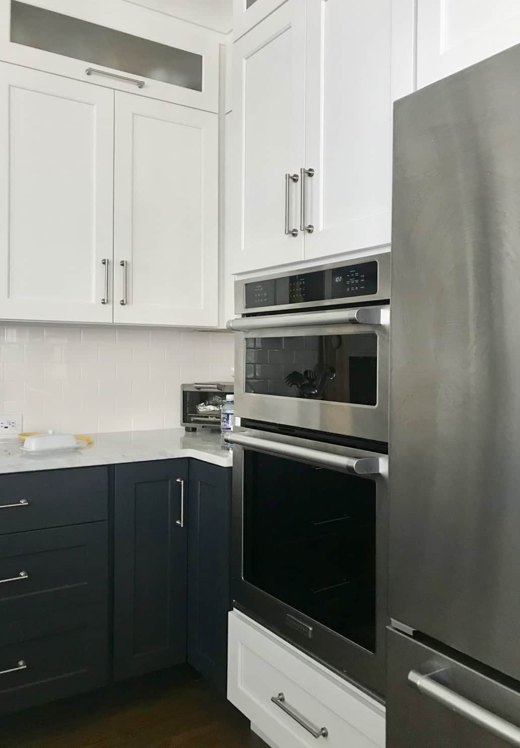 Stainless refrigerator and oven/microwave combo in a classic kitchen