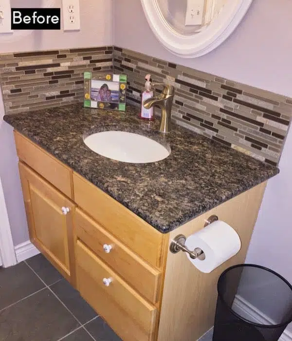 Before picture of vanity with backsplash and counter that don't match.