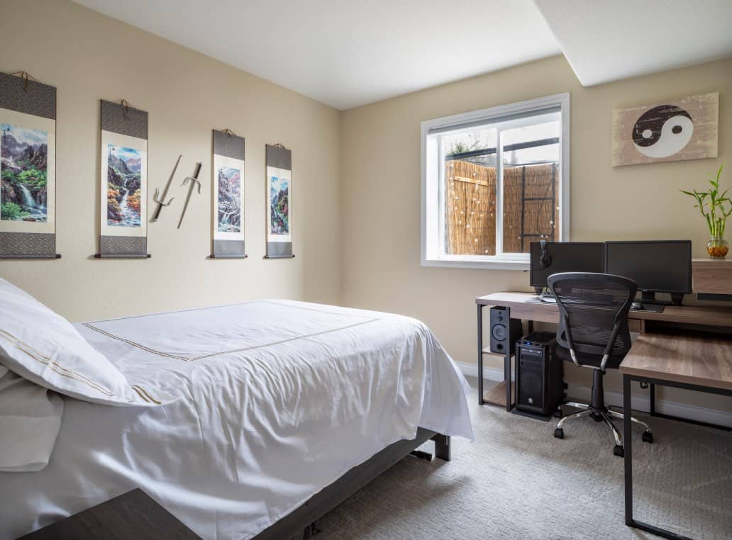 Basement bedroom with manchester tan and bamboo window well