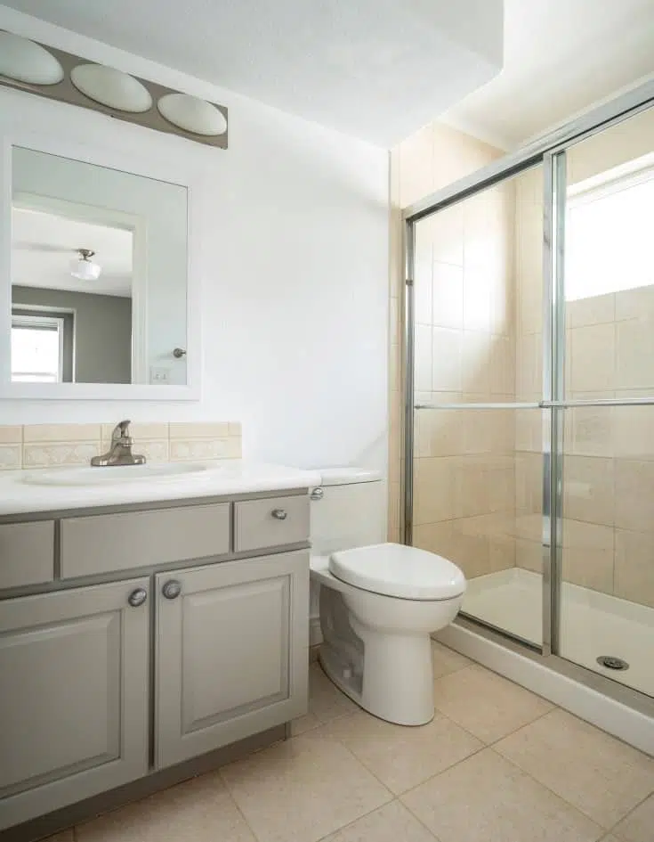 A bathroom painted with Chantilly Lace and a Rockport Gray vanity