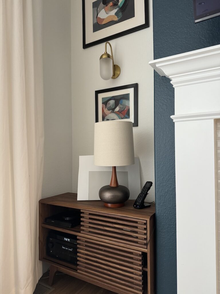 A paint swatch is being used for testing paint colors next to a lamp and window