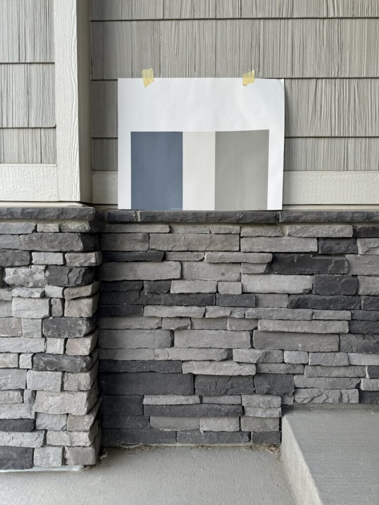 An example of how to test exterior paint colors using samples on white poster board