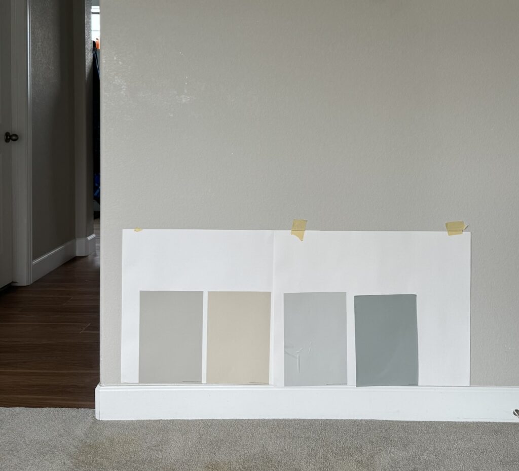 An example of the correct way to test interior paint colors using white poster board.