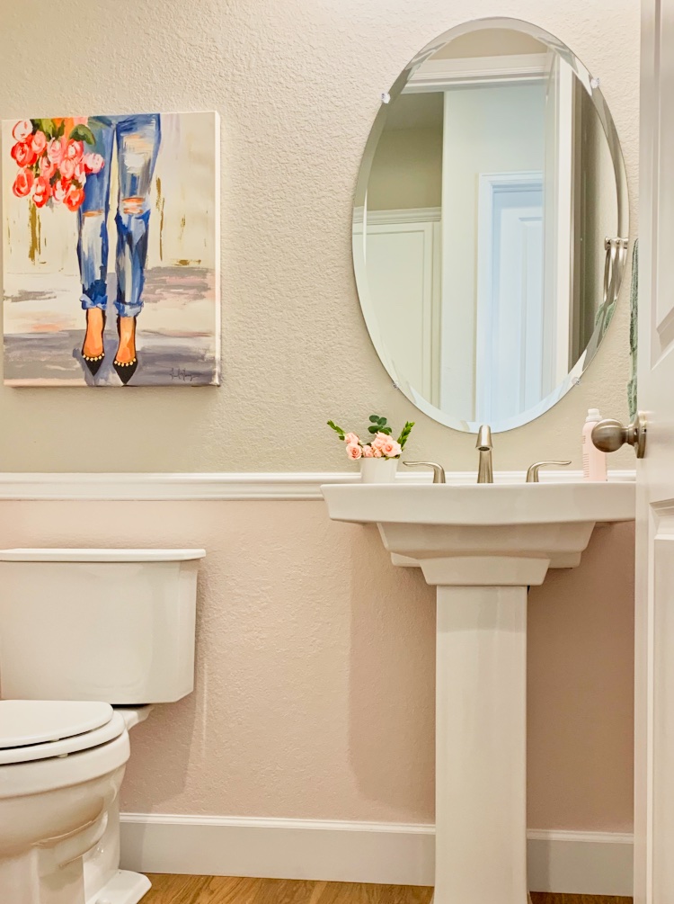 Powder room painted with BM First Light (2104-10) bottom and SW Agreeable Gray on top.