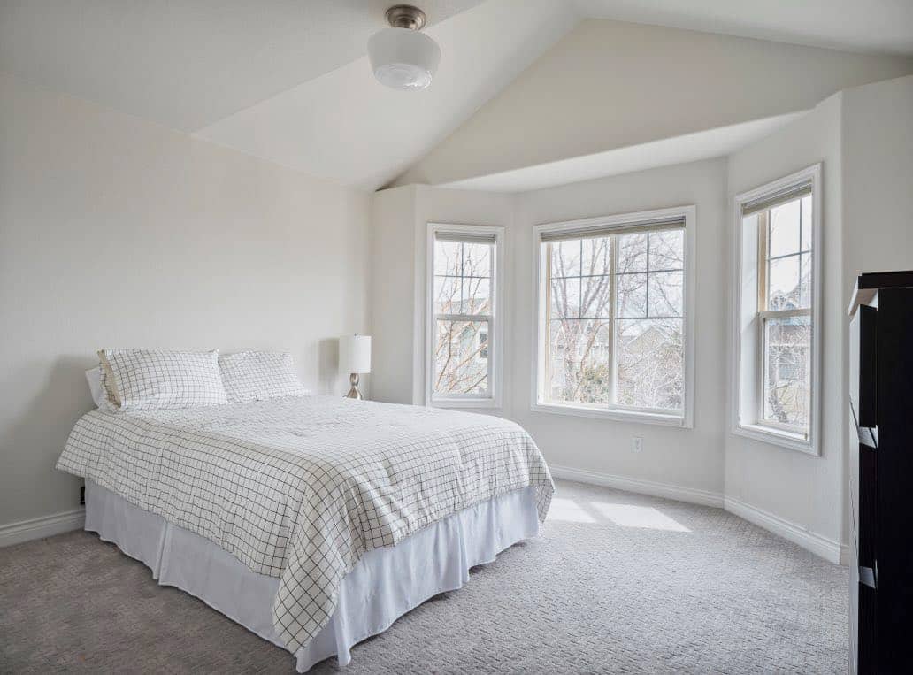 Bedroom painted with Classic Gray wall and ceilings and Chantilly Lace trim