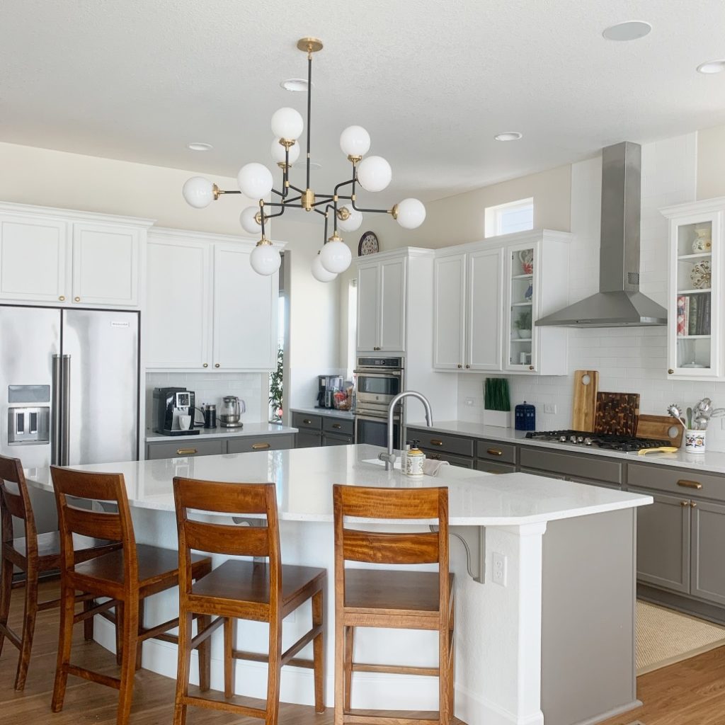 Walls painted with White Duck white paint. Upper Cabinets painted with Snowfall White and lower cabinets Chelsea Gray HC-168