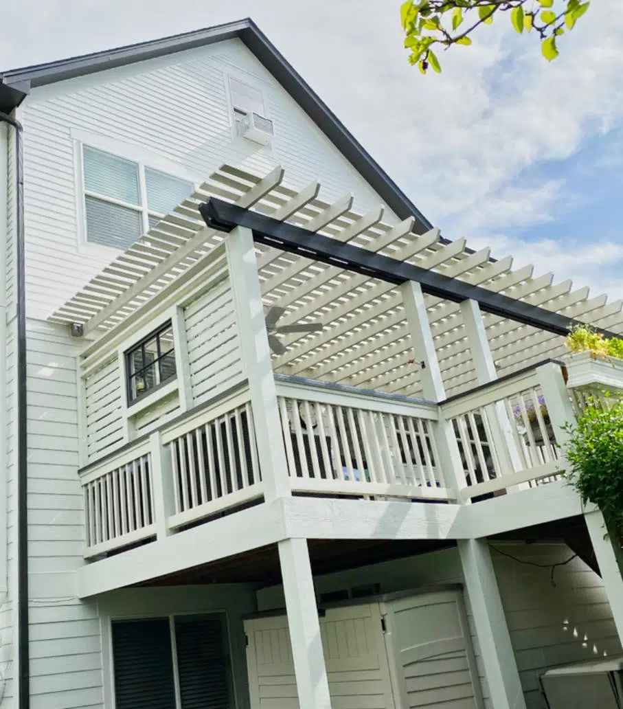 White back porch with black beam