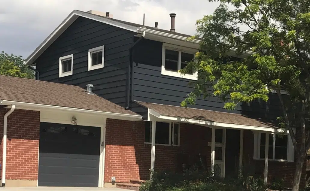 Red brick house with blue paint and white trim