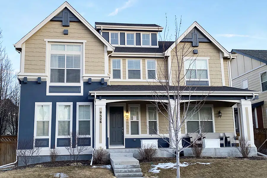 Exterior blue color palette with tan secondary color and white trim