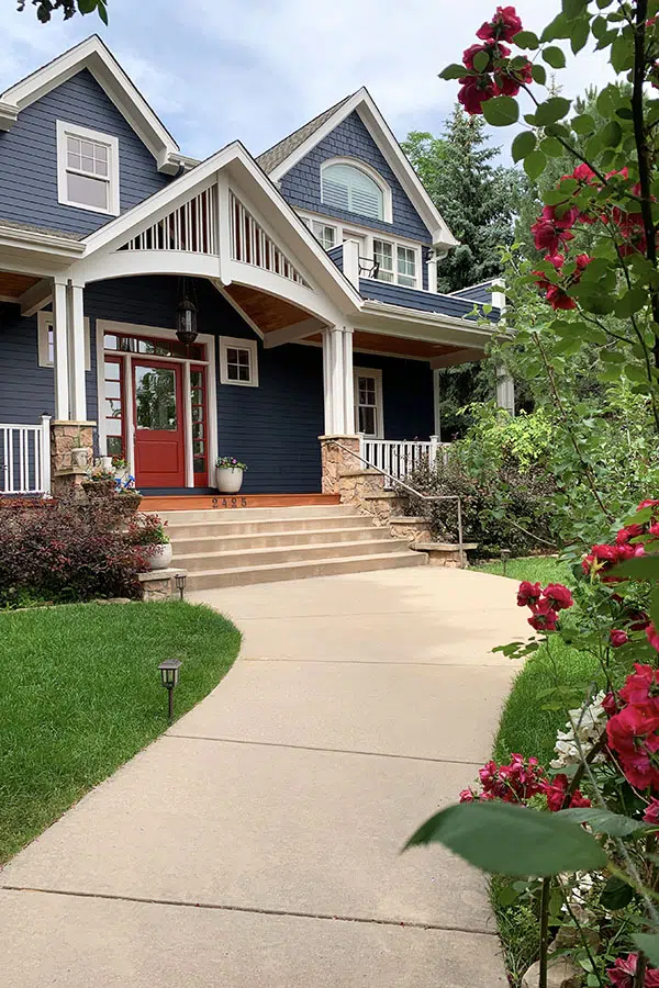 Blue house with white trim and red front door