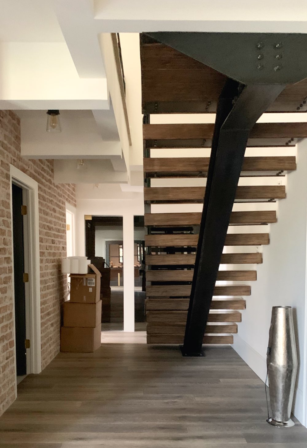 Cloud white walls in basement under stairs