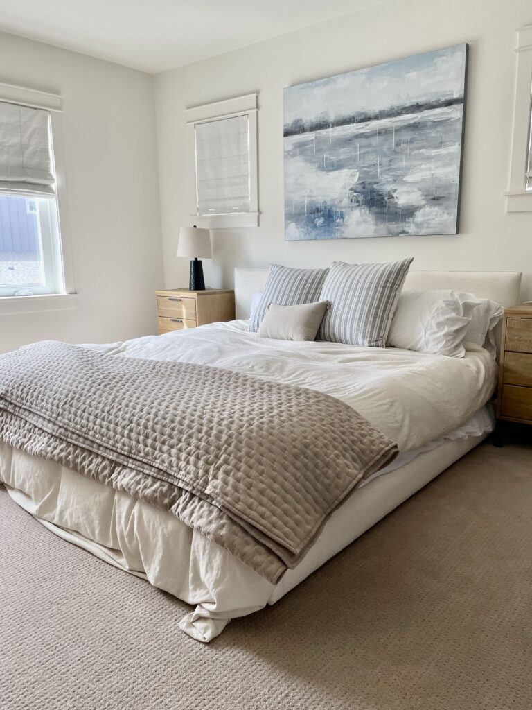 A bedroom is painted with Benjamin Moore Cloud White paint.