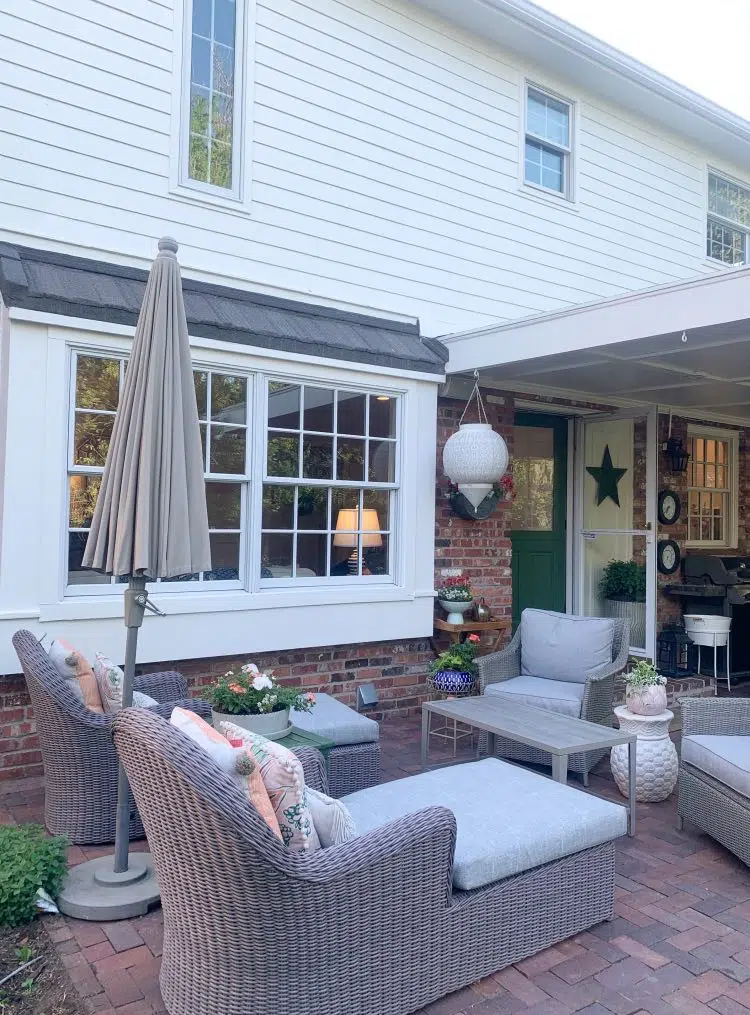 Red brick patio with outdoor living room and SW Greek Villa paint