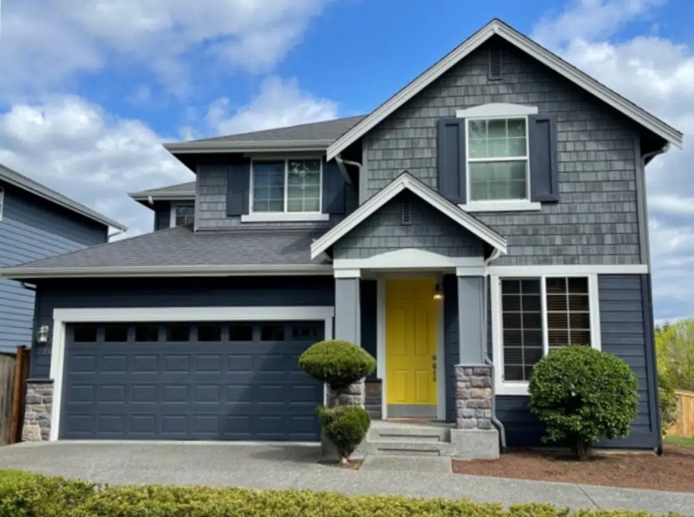 House with gray roof, SW Cyberspace siding, garage door and shutters with SW Westchester Gray shingles.