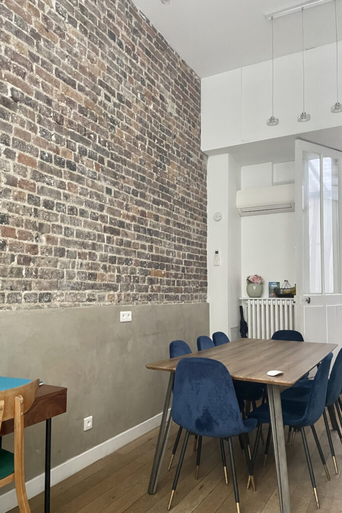Dining room with brick accent wall