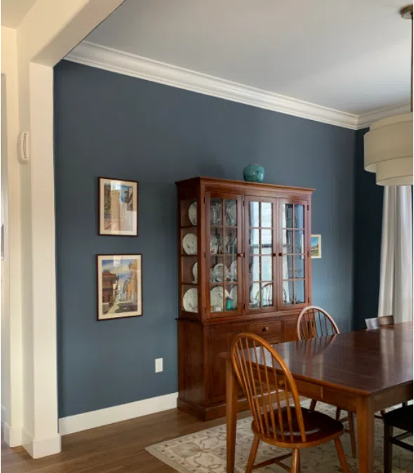 Dining room with SW Granite Peak walls and warm wood furniture