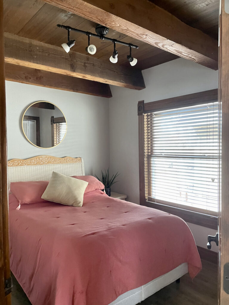 North facing bedroom with wood beams and Repose gray walls