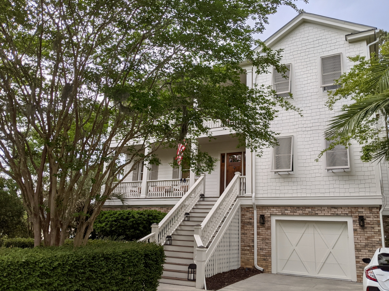 White house with light brick painted with SW Oyster White