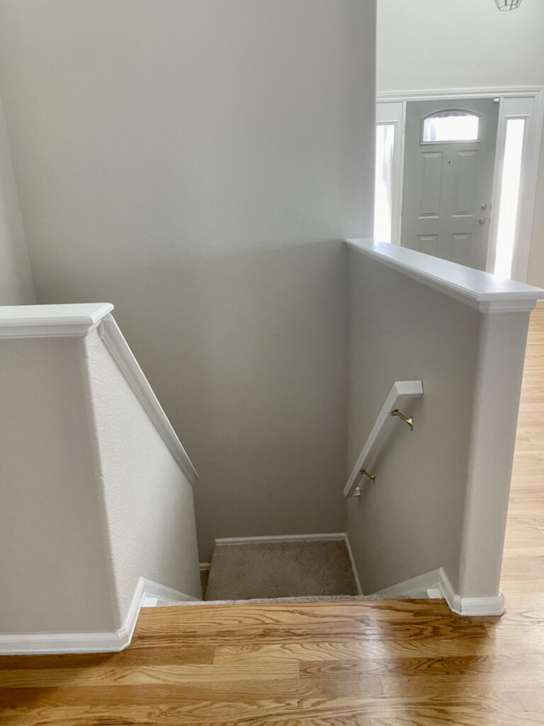 Stairway painted with Gossamer Veil walls and extra White trim