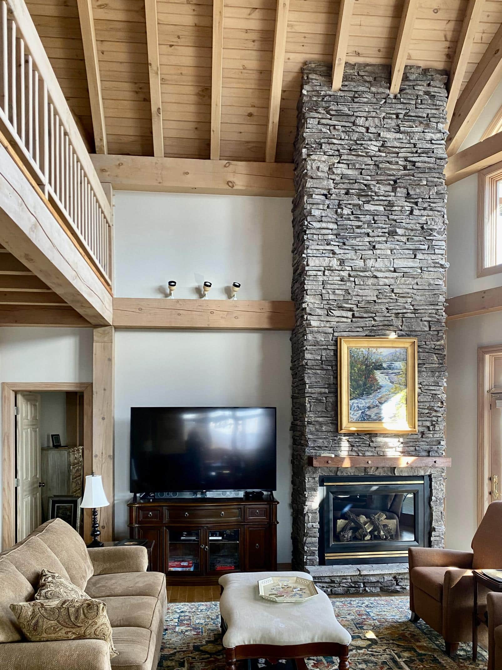 A living room with Sherwin-Williams Gossamer Veil wall paint.