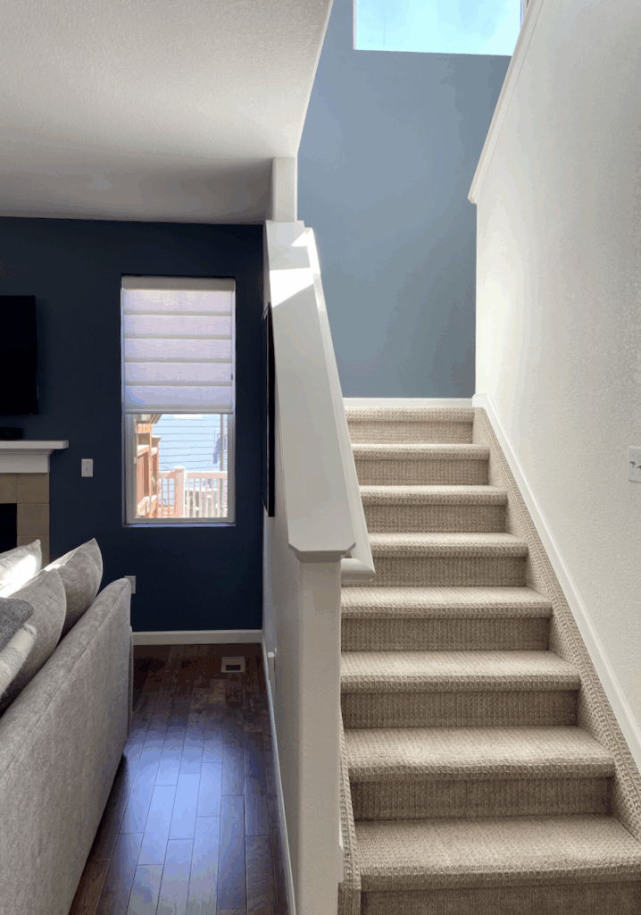 Granite Peak. in a shady room on the left and light filled stairway on the right.