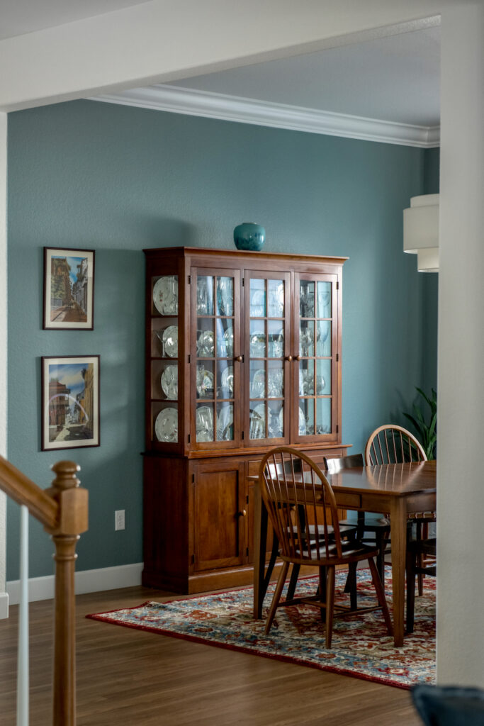 A dining room wall painted with Oval Room Blue by Farrow & Ball