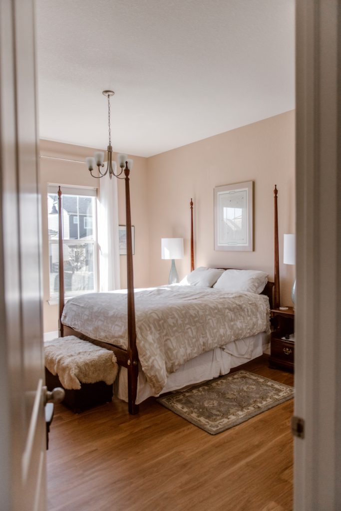 A bedroom is painted with Farrow & Ball Setting Plaster Bedroom Paint