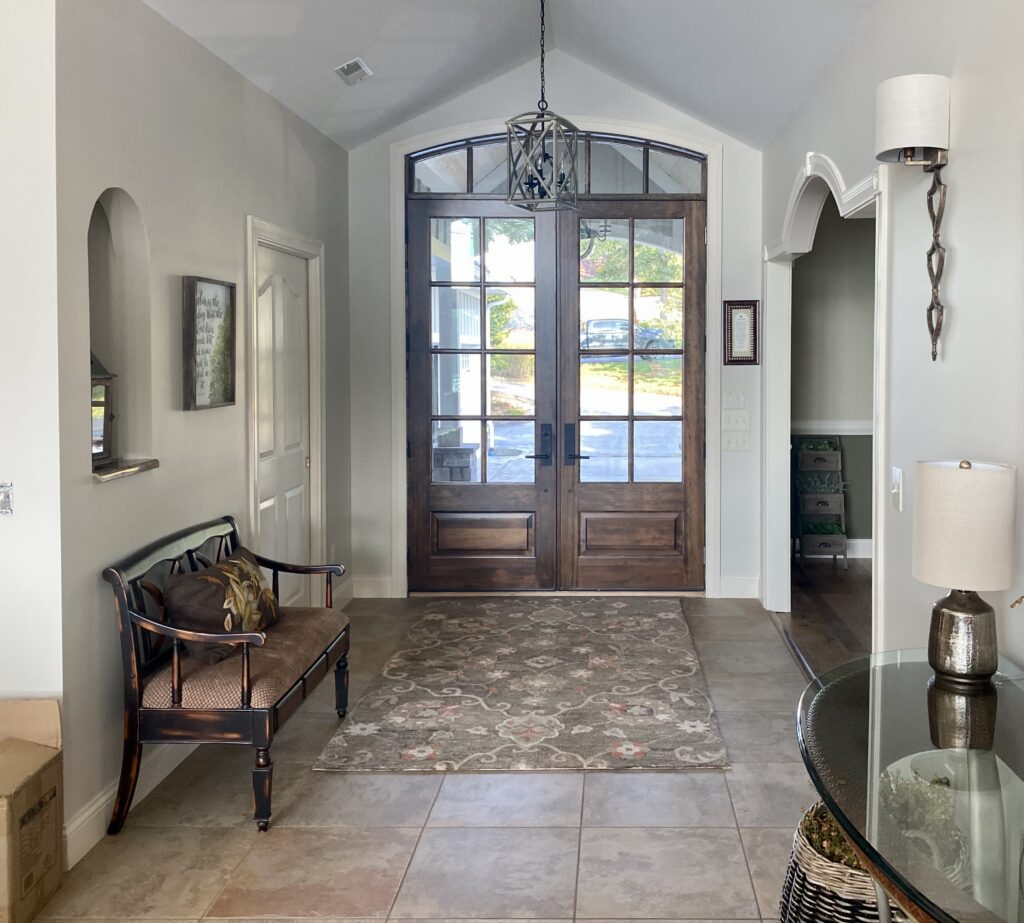 A lakehouse entryway painted with Edgecomb Gray wall paint.