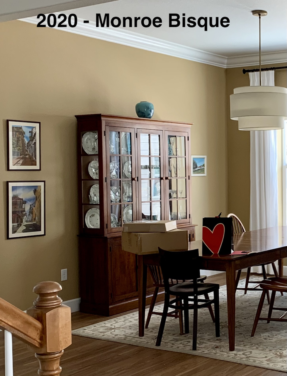 A dining room wall with Monroe Bisque paint color.