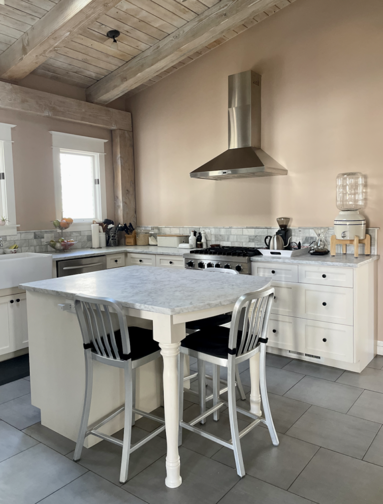 A kitchen painted with Farrow & Ball Setting Plaster paint as part of a whole house color palette.