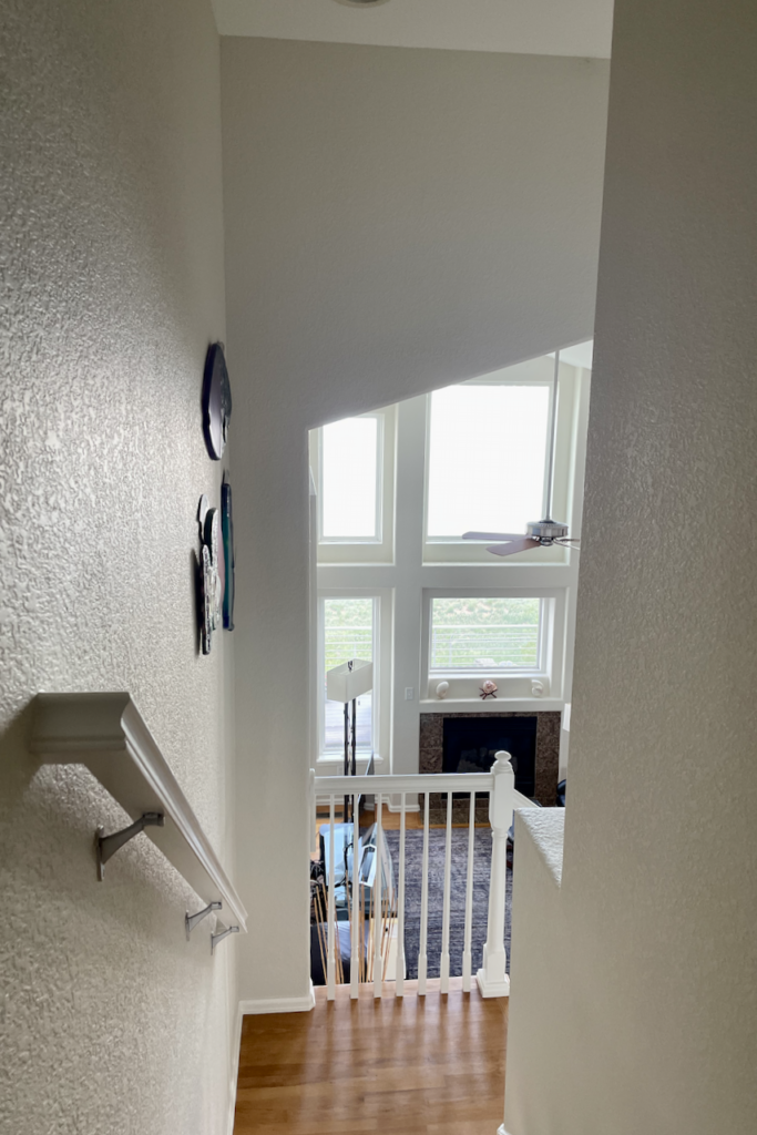 A stairwell painted with White Dove paint by Benjamin Moore as part of a whole house paint color scheme.