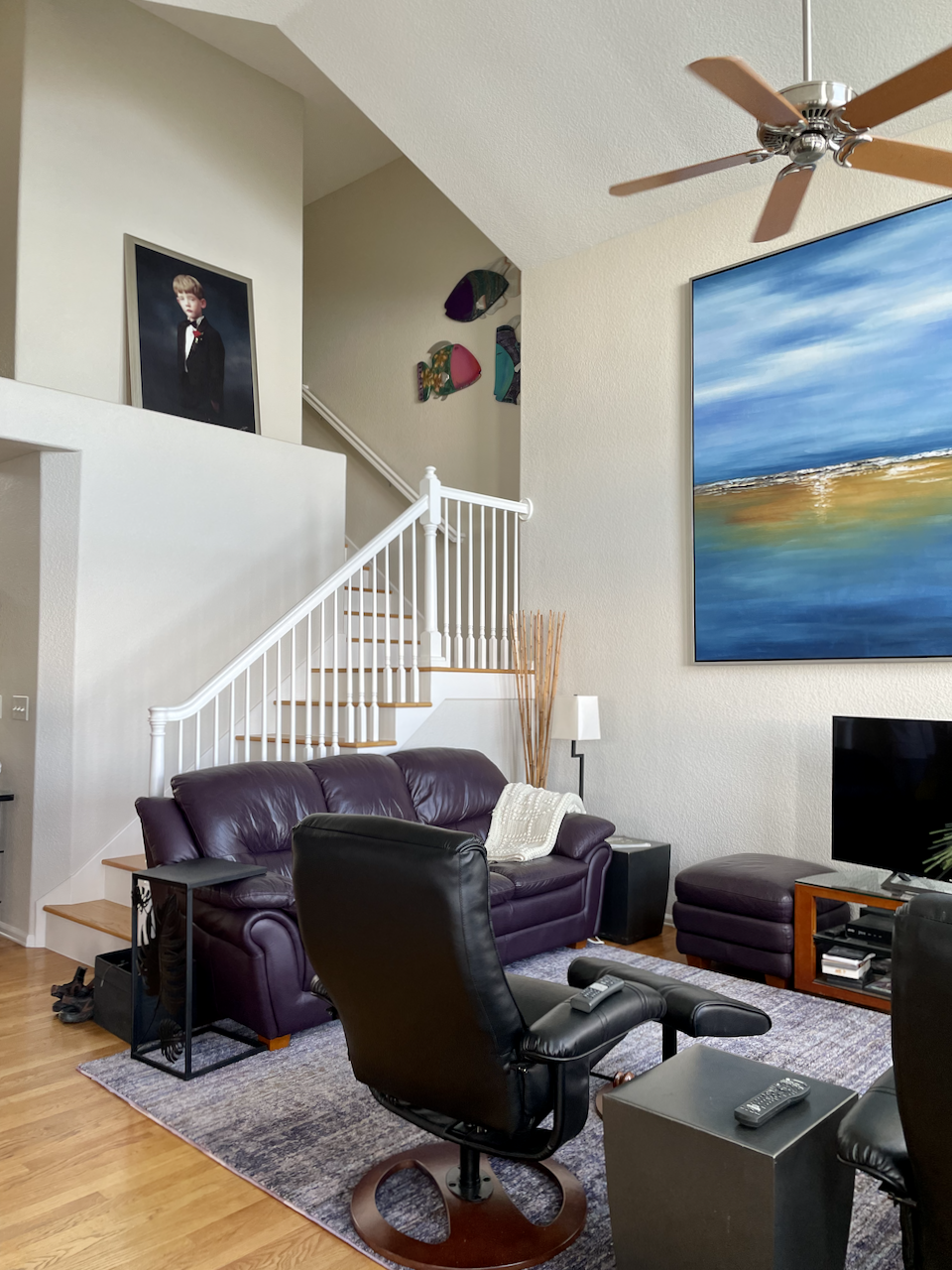 White Dove trim paint is used on the stairways and railings in this Denver home along with Gray Mist paint on the walls