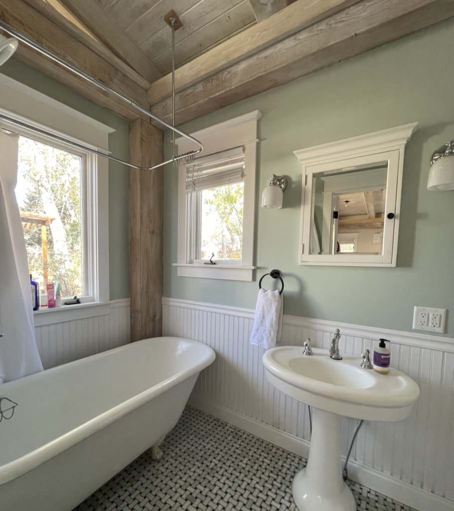 A bathroom is painted with Teresa's Green paint from Farrow & Ball