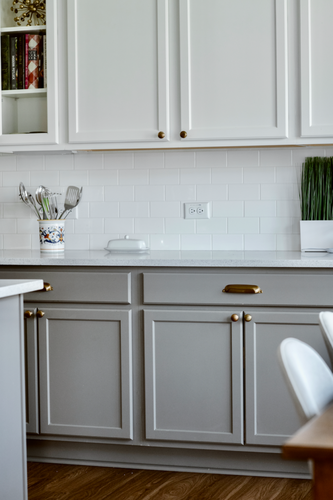 White and gray tuxedo kitchen cabinets are part of this timeless kitchen design