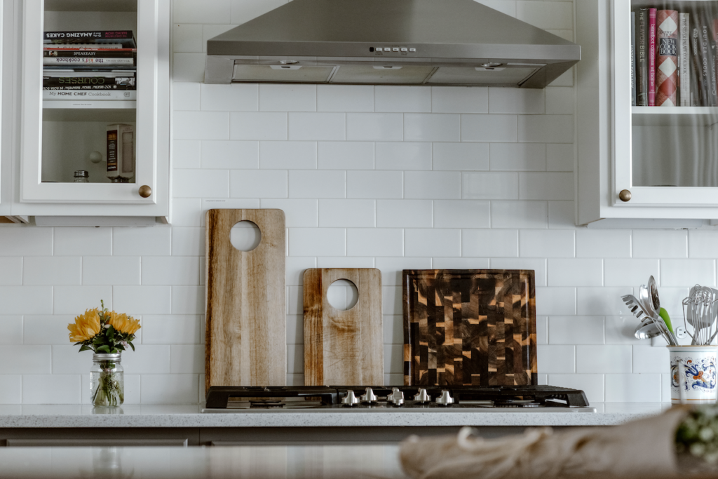 Stove top with cutting boards and cabinets