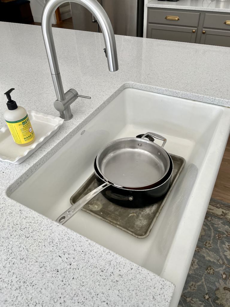 Farmhouse sink with dishes