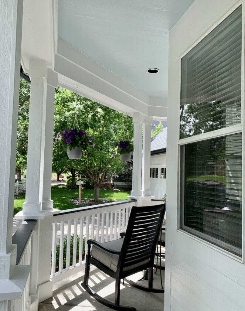Front porch with SW Pure White walls, SW Iron Ore handrail and SW Tradewind front porch ceiling.