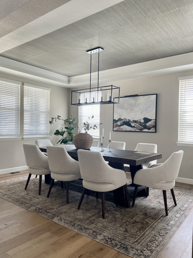 A dining room painted with Sherwin-Williams Accessible Beige paint.