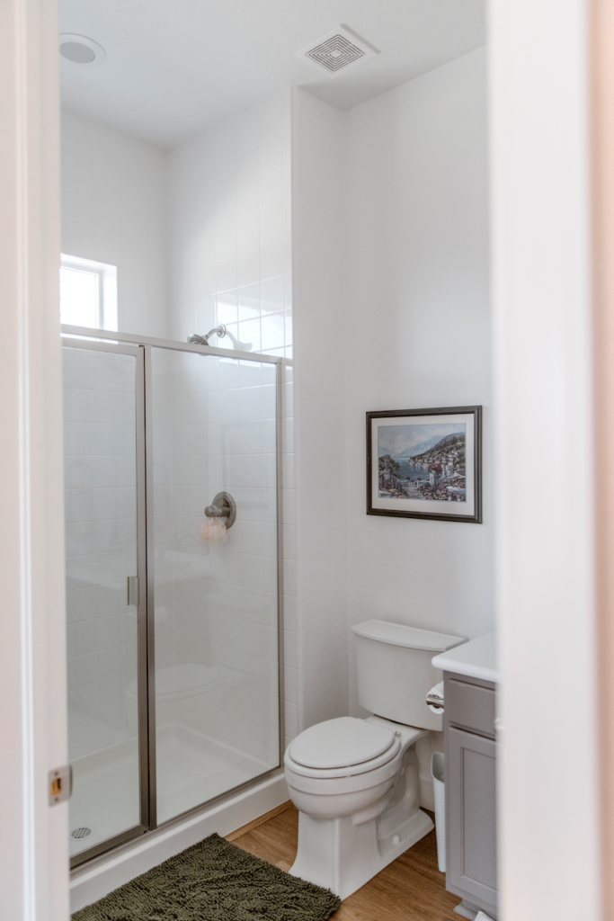A small bathroom is painted with Sherwin-Williams White Snow with an SW Extra White ceiling.