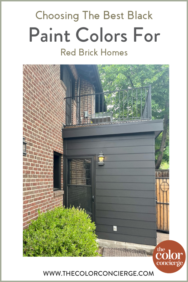 A home with red brick and black paint is featured