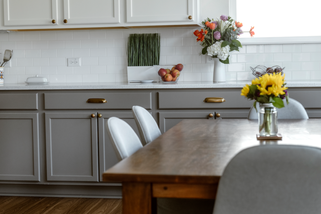 Tuxedo kitchen cabinets are painted with Chelsea Gray and Simply White paint
