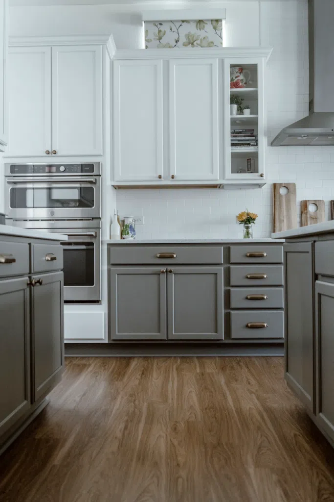 Tuxedo kitchen cabinets are painted with Chelsea Gray and Simply White.