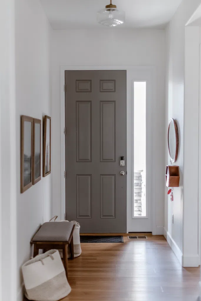 An interior front door is painted with BM Chelsea Gray paint.