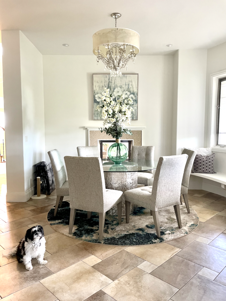 A dining room painted with Benjamin Moore Swiss Coffee paint. 