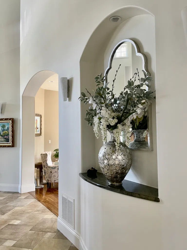 An entryway painted with Benjamin Moore Swiss Coffee paint.