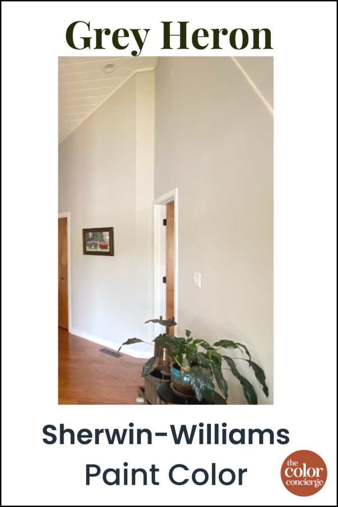 An entryway is painted with SW Grey Heron paint and an Attitude Gray door.