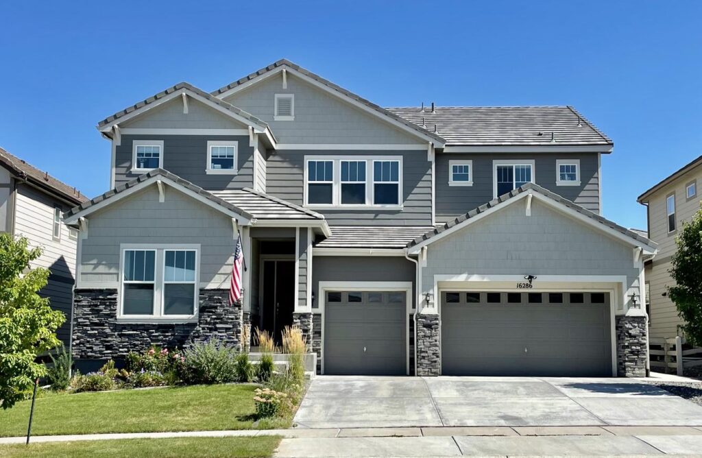 A Colorado home is painted with a Sherwin-Williams Agreeable Gray Exterior Paint trim
