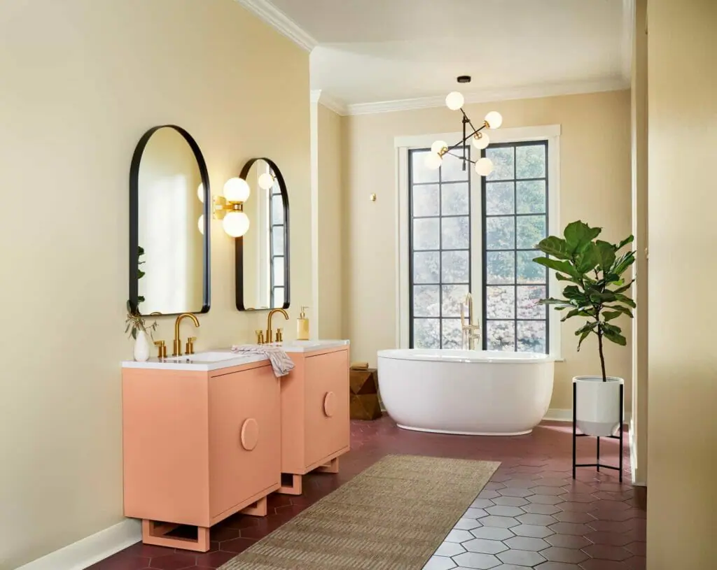 Bathroom walls painted with SW Softer Tan and SW Persimmon cabinets.