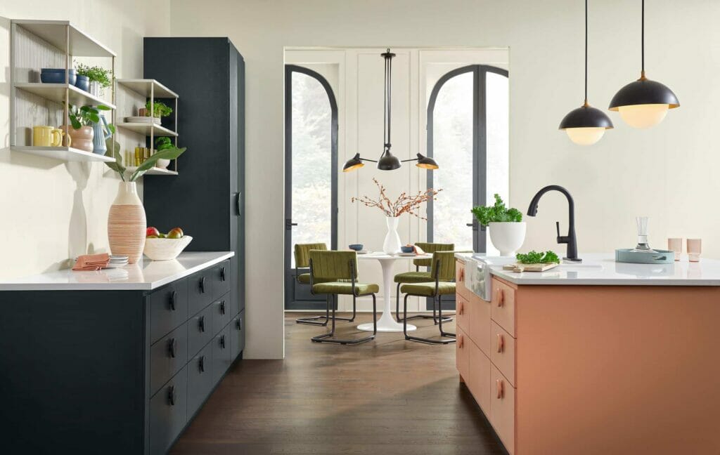 Learn how to use the 2024 Color Collection from HGTV Home by Sherwin-Williams.  Kitchen with Pearly White walls, Cyberspace cabinets, and Persimmon kitchen island.